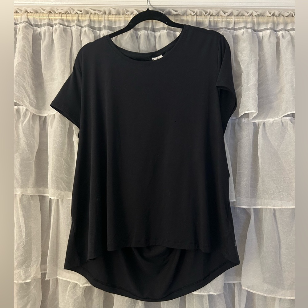 black work out top with cutout in back (does not show much of your back when on)